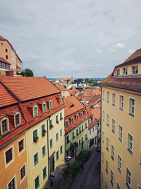 Buildings in town against sky
