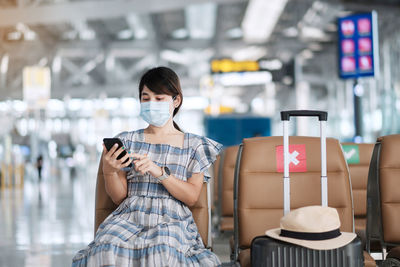 Portrait of woman using mobile phone