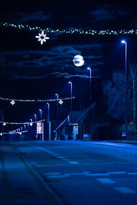 Illuminated street lights at night