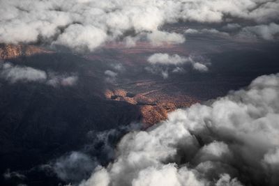 Scenic view of clouds over mountain against sky