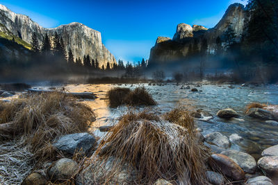 Panoramic view of rocks in sea against sky