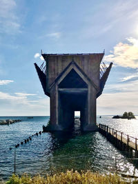 Pier over sea against sky