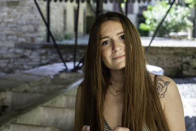 Portrait of young woman outdoors