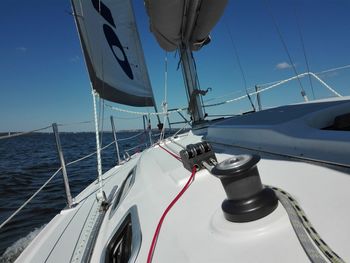 Sailboat on sea against sky