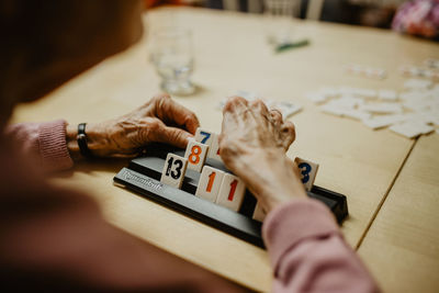 Close-up of hand holding table