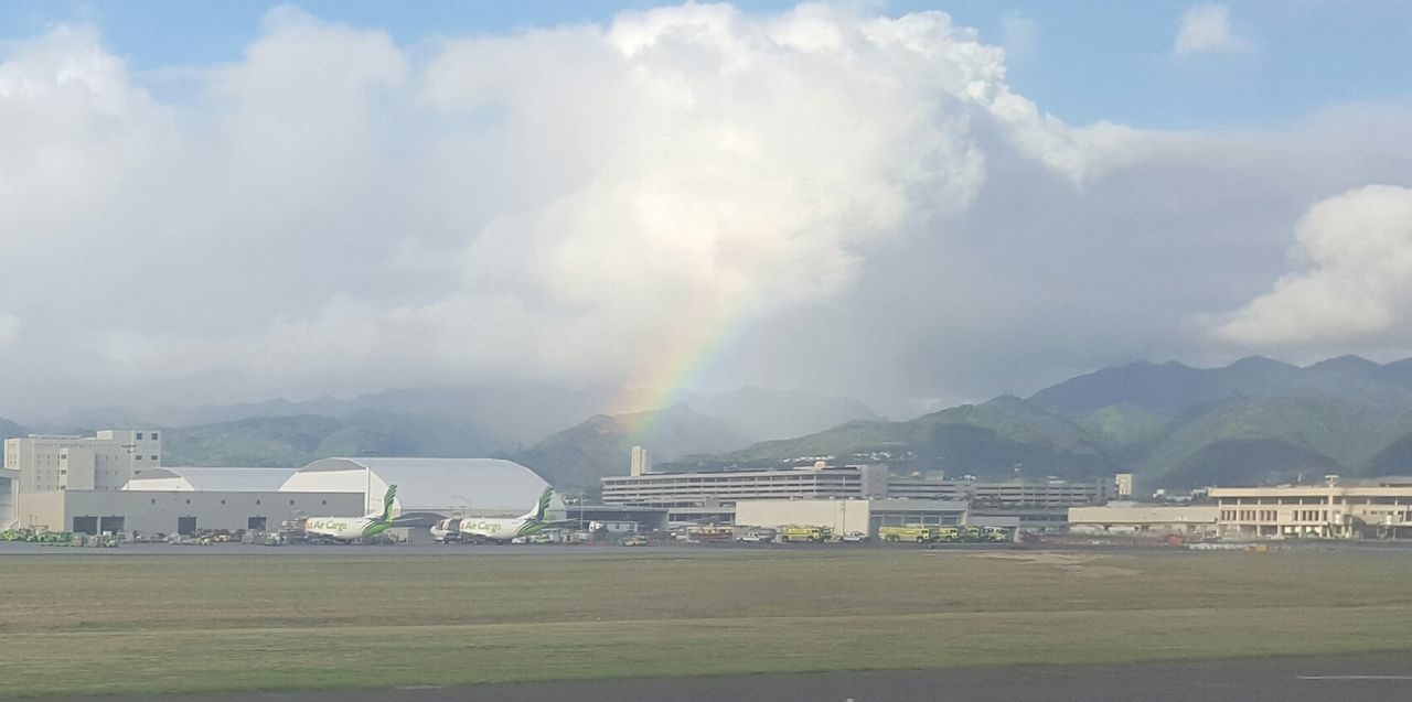 SCENIC VIEW OF RAINBOW OVER MOUNTAINS