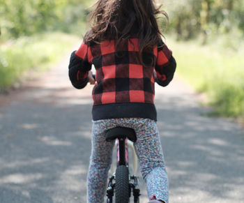 Rear view of girl on bicycle