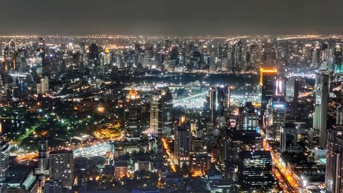 High angle view of illuminated city buildings at night