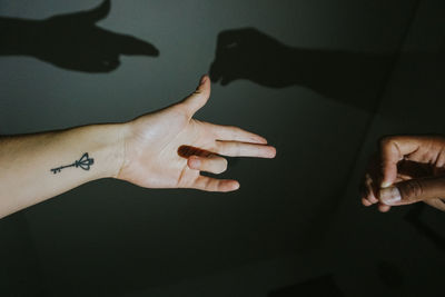 Close-up of hand on shadow