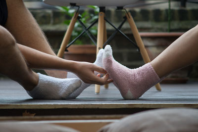 Close-up of man tickling woman