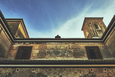 Low angle view of built structure against blue sky