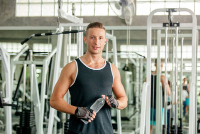 Portrait of man standing in gym