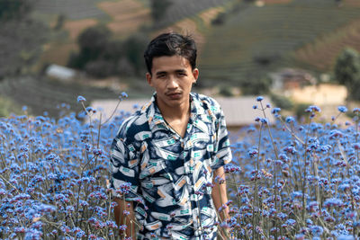 Portrait of young man standing outdoors