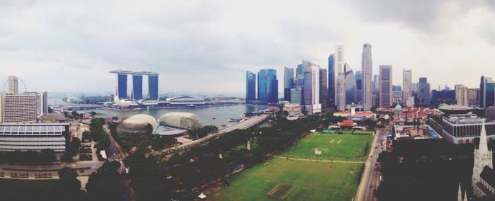 Cityscape against cloudy sky
