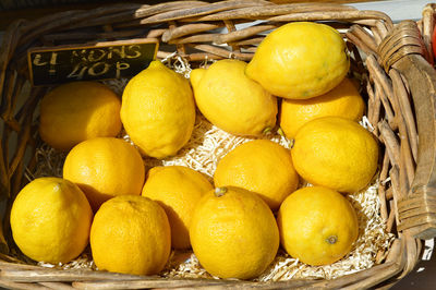 Fresh yellow lemons in a basket foe sale