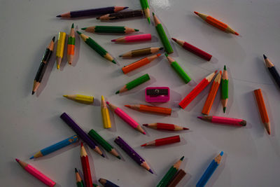 High angle view of colored pencils on table