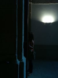 Woman standing at night