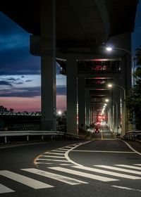 View of bridge in city at night