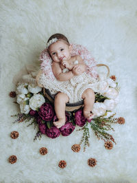 Portrait of cute girl playing with christmas tree