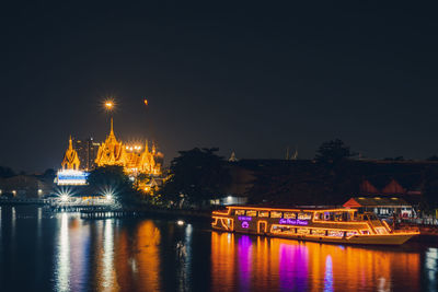 Illuminated buildings at waterfront