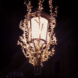 Low angle view of illuminated chandelier