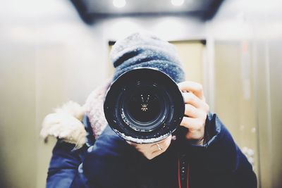 Close-up of hand holding camera