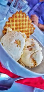 Close-up of hand holding ice cream