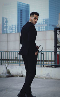 Young man standing in city