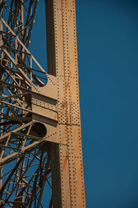 Low angle view of tower against blue sky