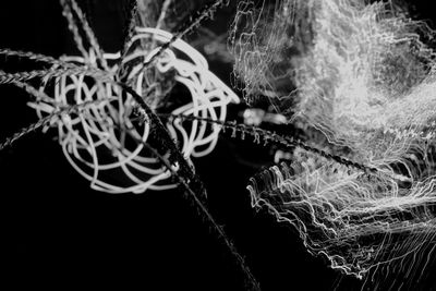 Close-up of ropes against black background