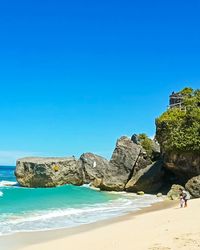 Scenic view of sea against clear blue sky