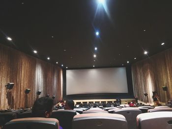 Group of people in the dark room