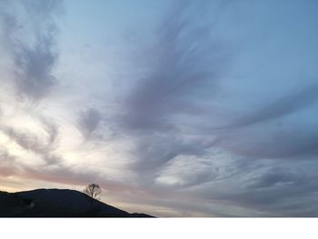 Low angle view of silhouette mountain against sky