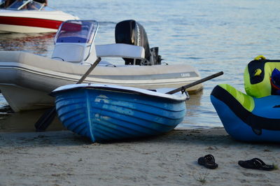 Boats moored on beach