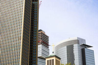 Low angle view of modern buildings against clear sky