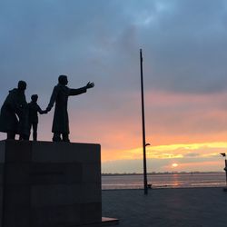 Scenic view of sea against sky at sunset