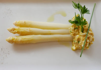 High angle view of cooked asparagus served in plate