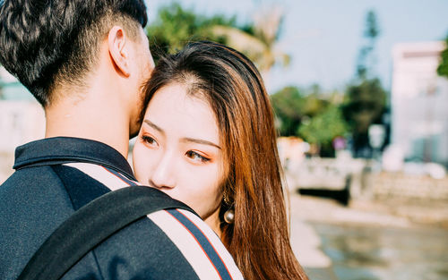Portrait of couple kissing outdoors