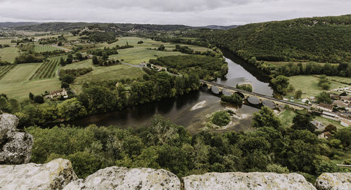High angle view of river amidst buildings against sky