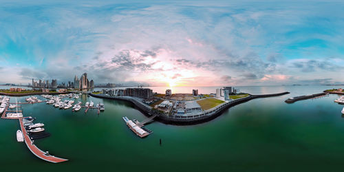 Panoramic view of cityscape against sky during sunset