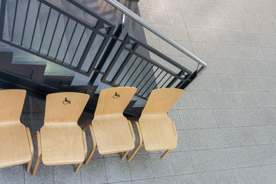 High angle view of chairs on seat
