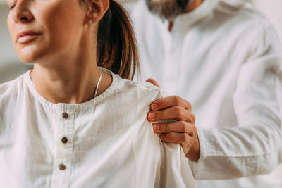 Woman enjoying shiatsu neck and shoulders massage.