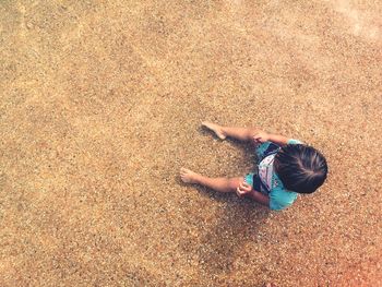 High angle view of people on sand at beach