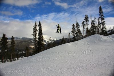 Low angle view of man snowboarding