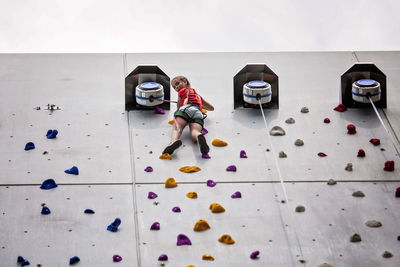 High angle view of people walking on floor