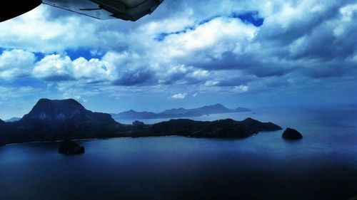 Scenic view of lake against cloudy sky