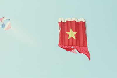 Kites flying against clear sky