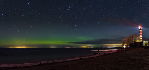 Scenic view of beach against sky at night