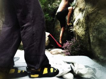 Low section of woman standing on tiled floor