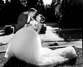 Rear view of couple sitting in park